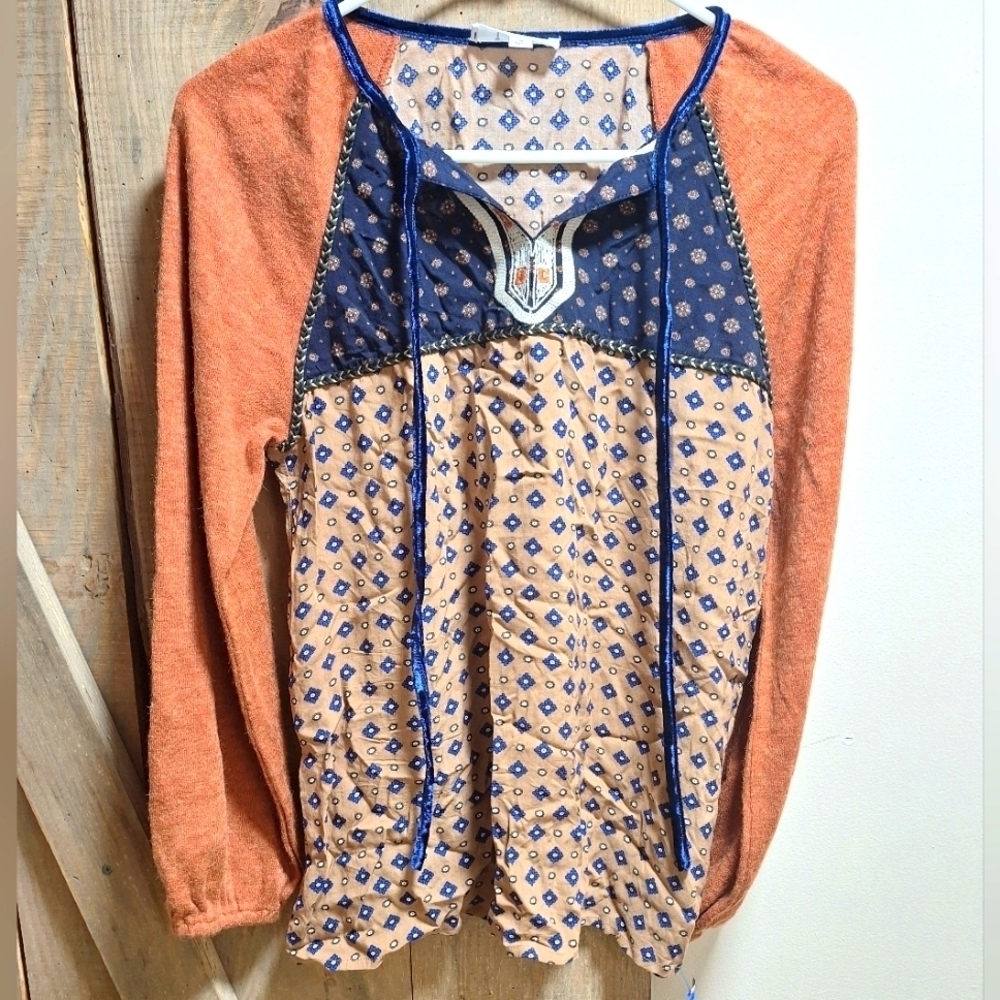 A THML long sleeve multi-media peasant top in a ladie's size small in EUC.